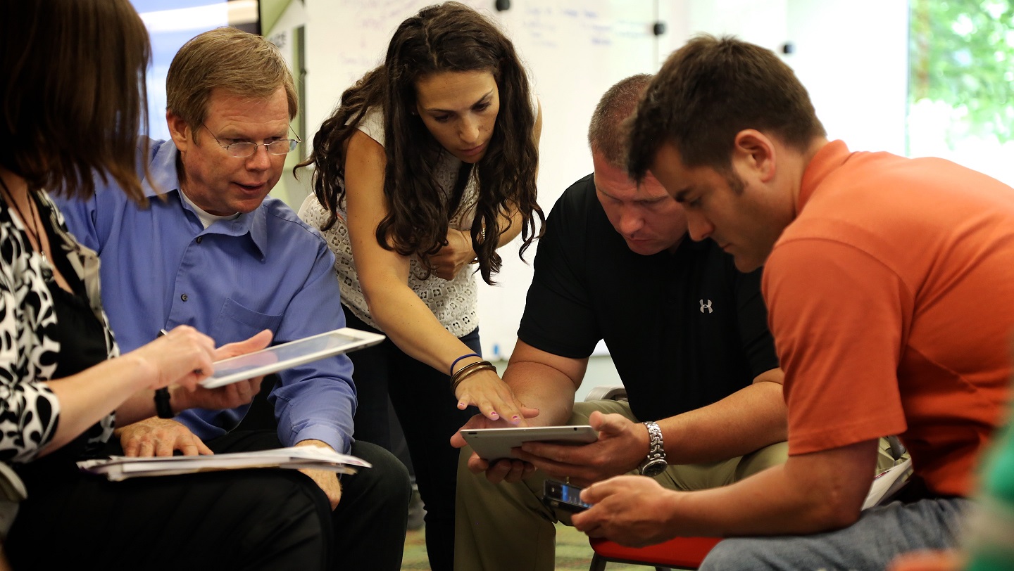 A group of teachers discussing