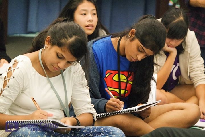 A group of young students studying hard